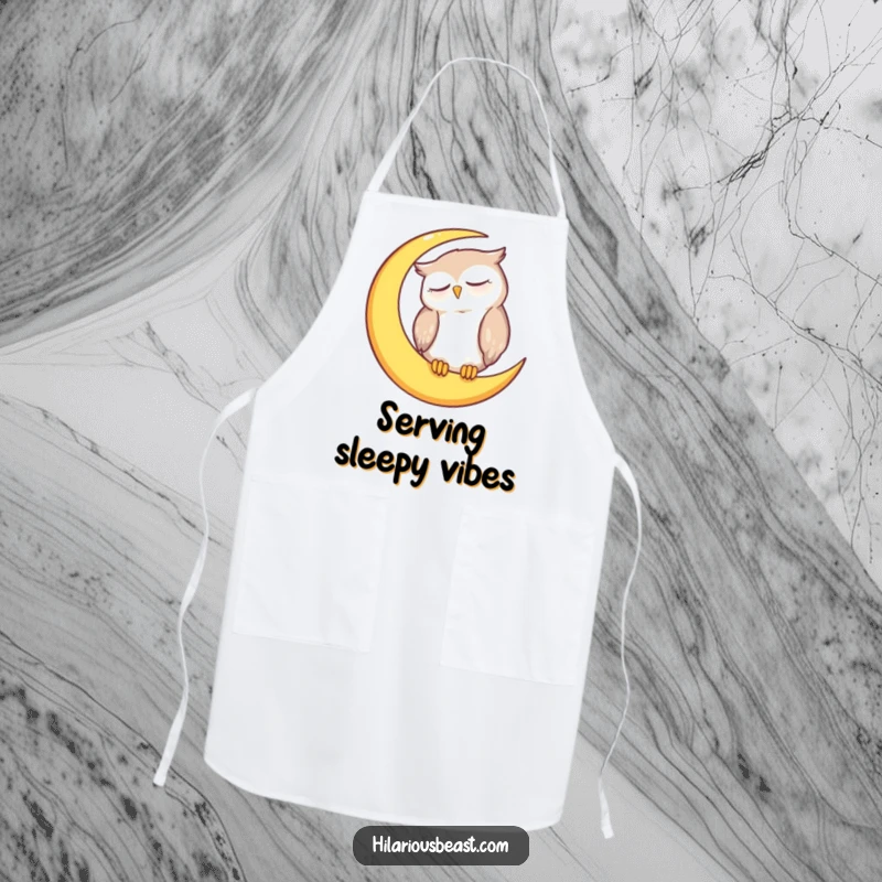 Funny owl apron featuring a sleepy owl character resting on a crescent moon, ideal for kitchen use.
