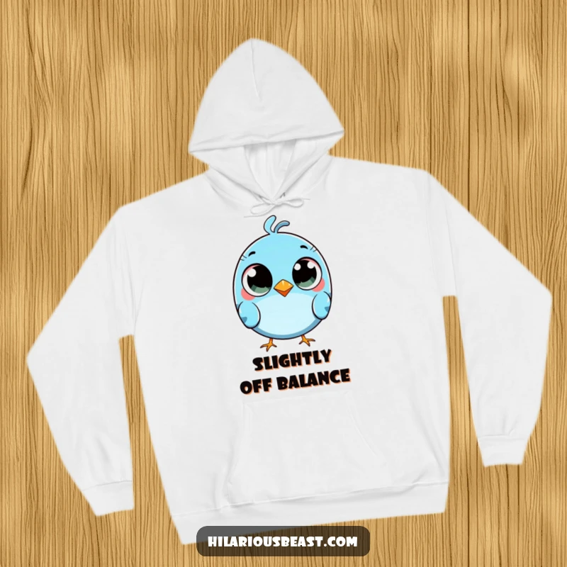 Funny round blue bird hoodie with comically wide eyes, tripping slightly, offering cozy humor.