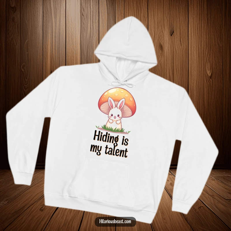 Funny and cozy hoodie showcasing a fluffy bunny with curious eyes peeking from behind a colossal, vividly colored mushroom.