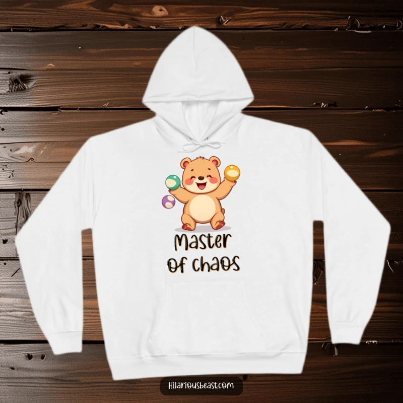 Funny bear cub hoodie showing a chubby cub juggling three colorful balls with a wide grin, for cozy circus vibes.