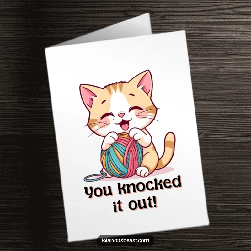 Funny Free Printable Congratulations Card: A happy cat batting a yarn ball, a delightful downloadable gift for celebrations.