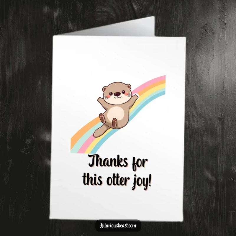 Funny Free Printable Thank You Card: A cute otter slides down a rainbow, arms outstretched, sending a wave of cheerful and whimsical thanks.