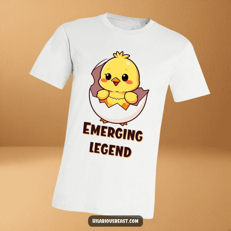 Funny yellow chick emerging from an eggshell, wide-eyed with surprise and happiness, on a vibrant t-shirt.