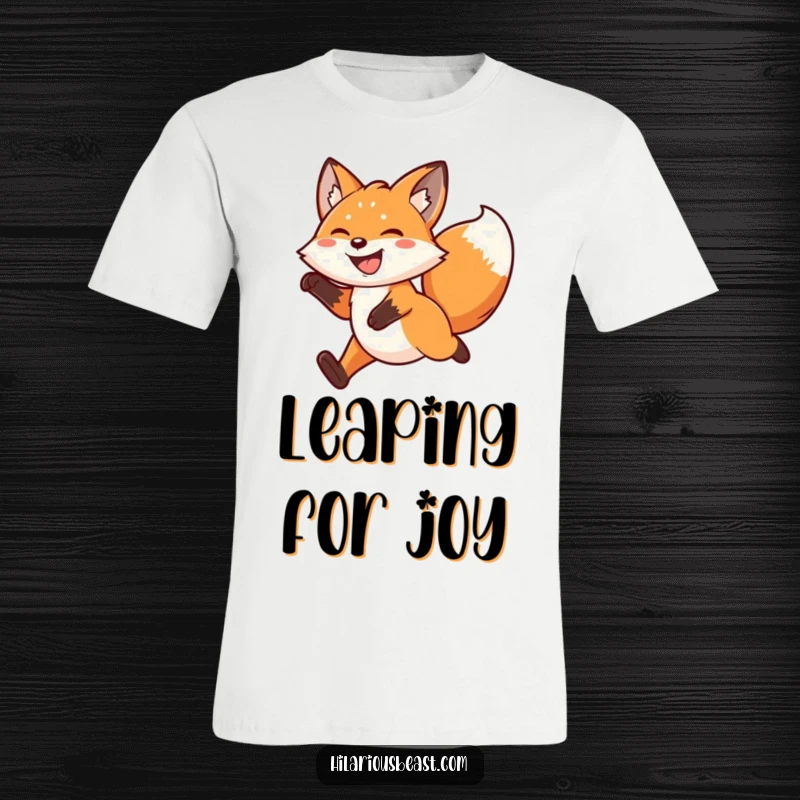 Funny kawaii fox t-shirt featuring an ecstatic fox mid-leap, grinning widely with a furiously wagging tail, capturing boundless energy.