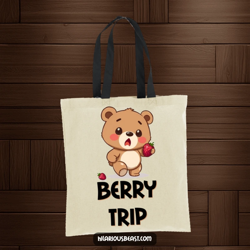 Funny brown bear cub tote bag, a surprised cub stumbling while attempting to balance a berry, ready for daily use.