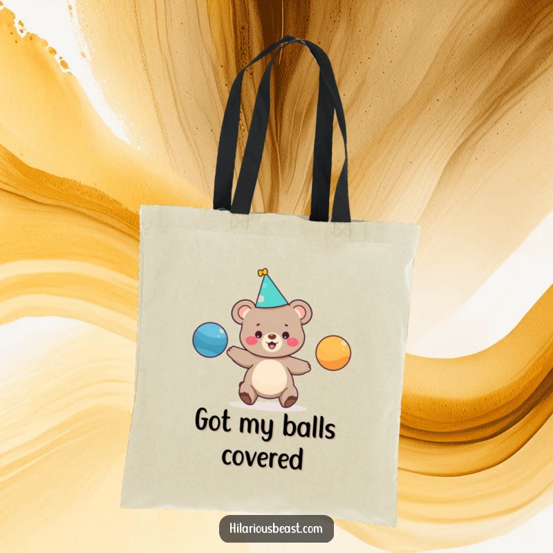 Funny tote bag showcasing a delightful bear cub in a party hat, expertly juggling three bright balls, perfect for a whimsical gift.