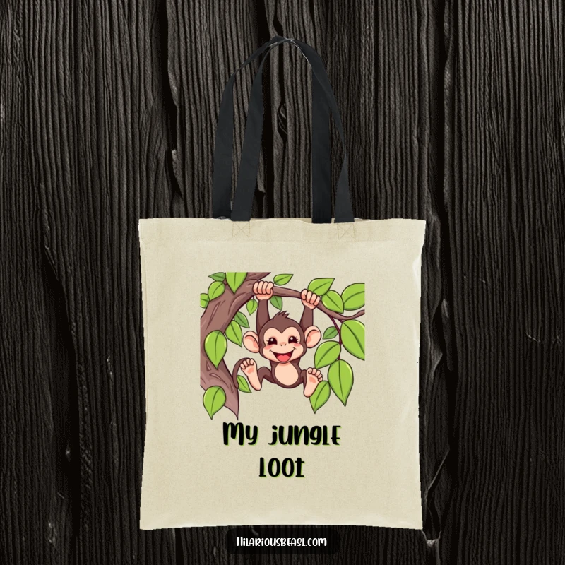 Funny Tote Bag featuring a mischievous monkey swinging from a vine with a grin, ready to carry your jungle treasures.